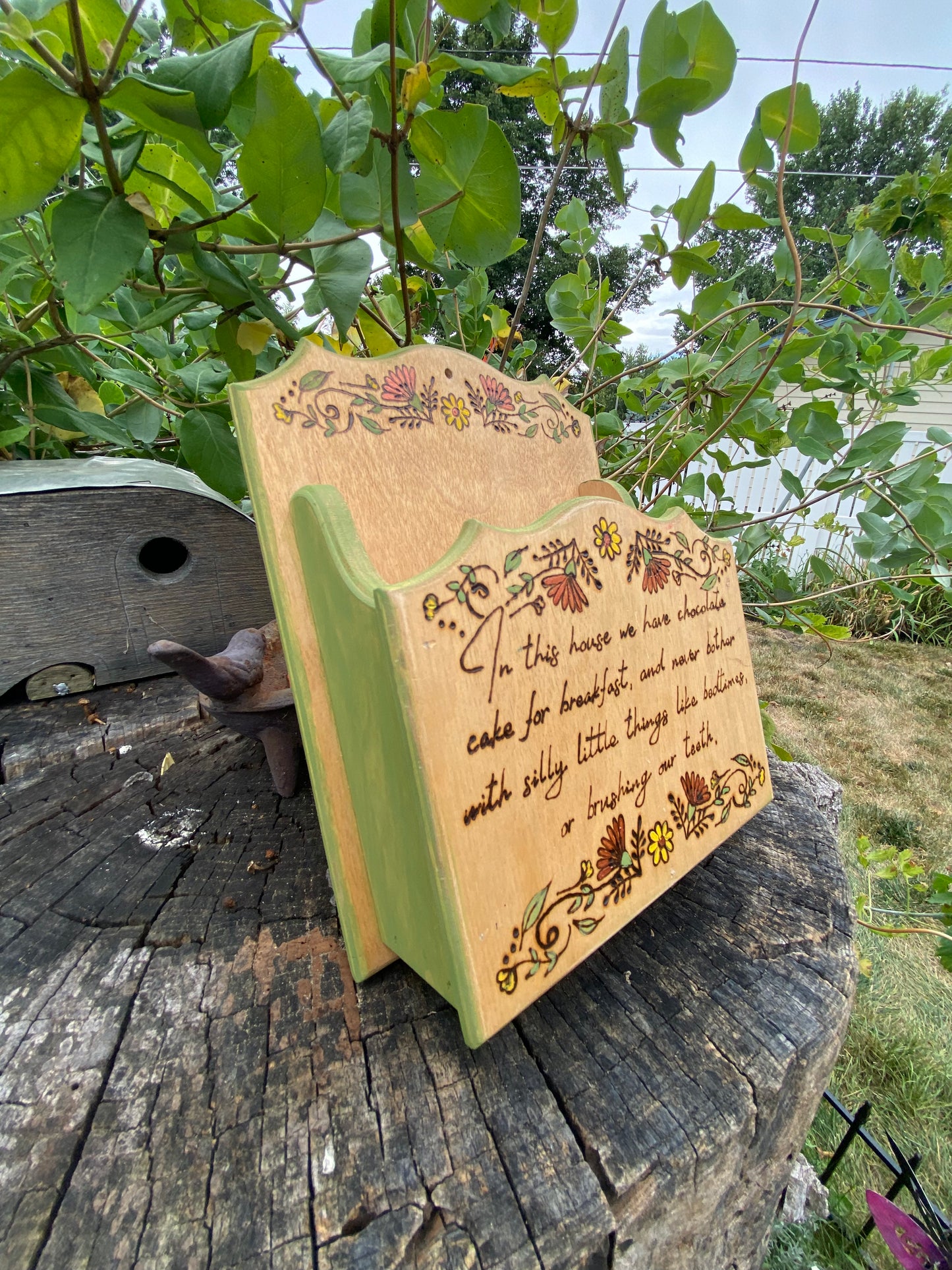 “In this house” wall container