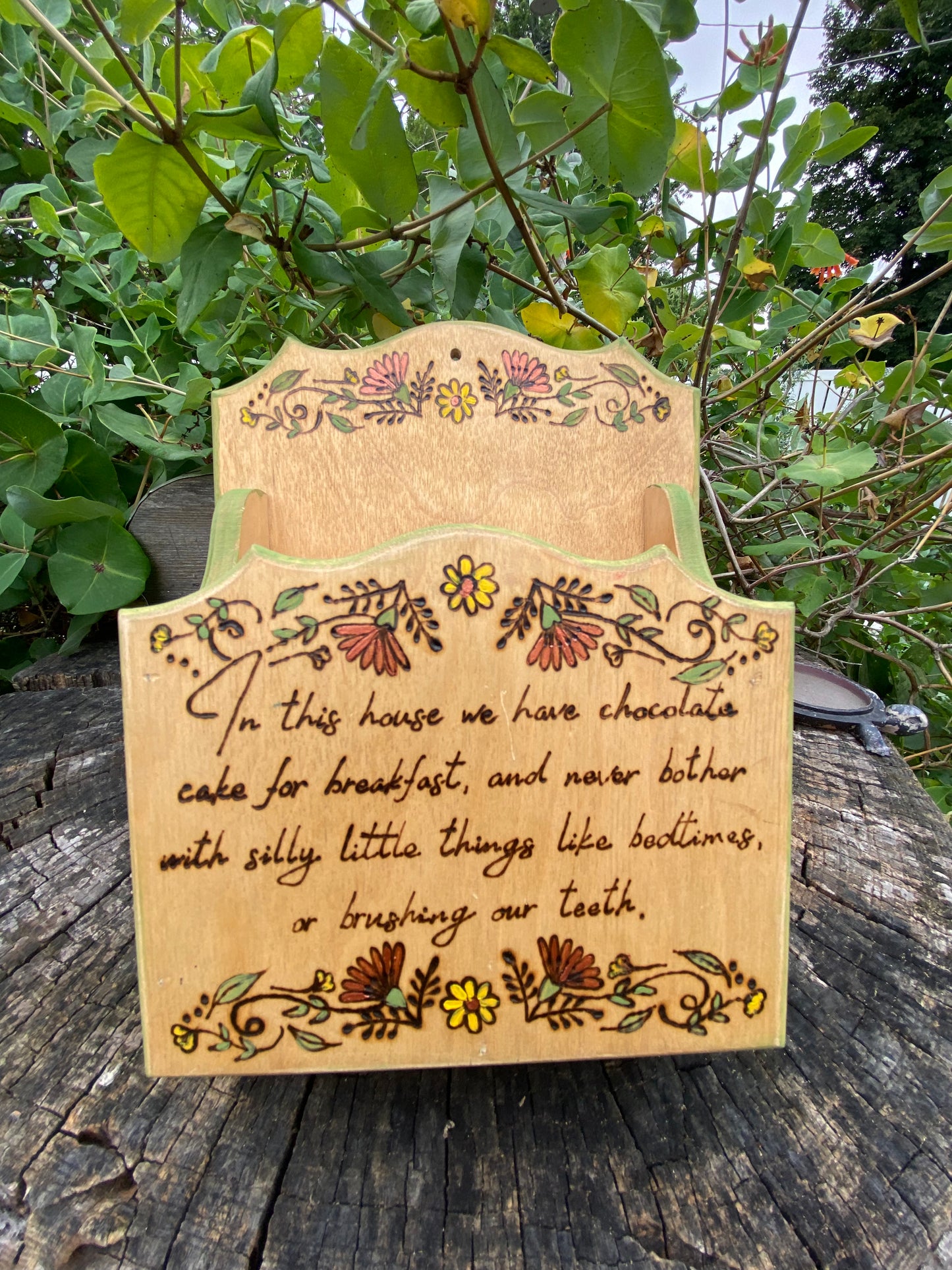 “In this house” wall container
